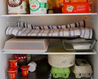 A glance into our fridge: the round glass bowl contains my sourdough starter