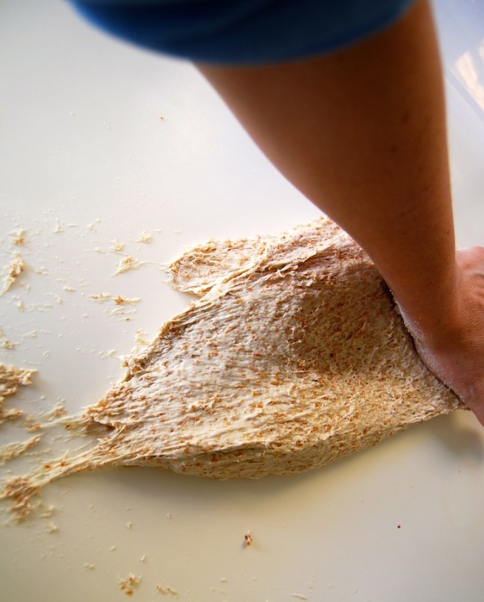 kneading sourdough